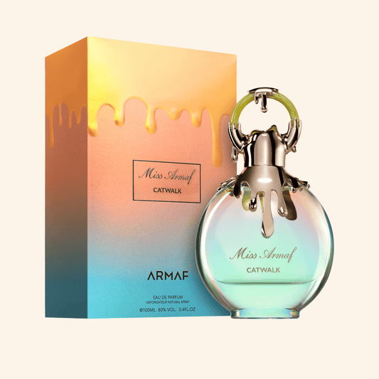 Armaf Miss Armaf Catwalk perfume bottle and packaging on a white background. Discover Armaf Miss Armaf Catwalk UK. A bold women's EDP with citrus, peach, vanilla, musk & ambroxan. A stunning J'adore alternative. Shop now at Nurabliss!