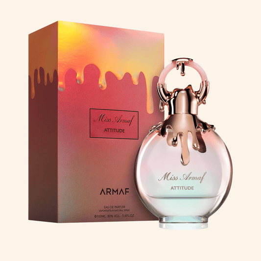 Armaf Miss Armaf Attitude perfume bottle and packaging on a white background. Discover Armaf Miss Attitude UK. A confident women's EDP with tuberose, jasmine, coffee, almond & tonka. A stunning Good Girl alternative. Shop now at Nurabliss!