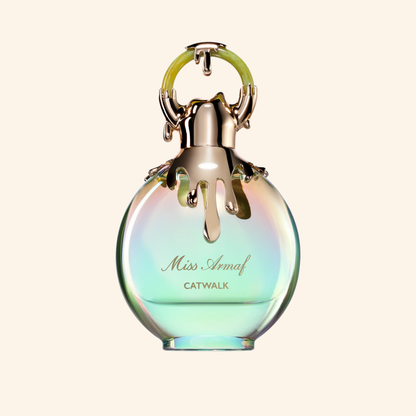 Miss Armaf Catwalk perfume bottle with gradient design on a light beige background. Discover Armaf Miss Armaf Catwalk UK. A bold women's EDP with citrus, peach, vanilla, musk & ambroxan. A stunning J'adore alternative. Shop now at Nurabliss!