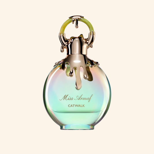 Miss Armaf Catwalk perfume bottle with gradient design on a light beige background. Discover Armaf Miss Armaf Catwalk UK. A bold women's EDP with citrus, peach, vanilla, musk & ambroxan. A stunning J'adore alternative. Shop now at Nurabliss!