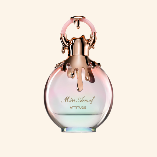 Perfume bottle with 'Miss Aemaf Attitude' text on a light background. Discover Armaf Miss Attitude UK. A confident women's EDP with tuberose, jasmine, coffee, almond & tonka. A stunning Good Girl alternative. Shop now at Nurabliss!