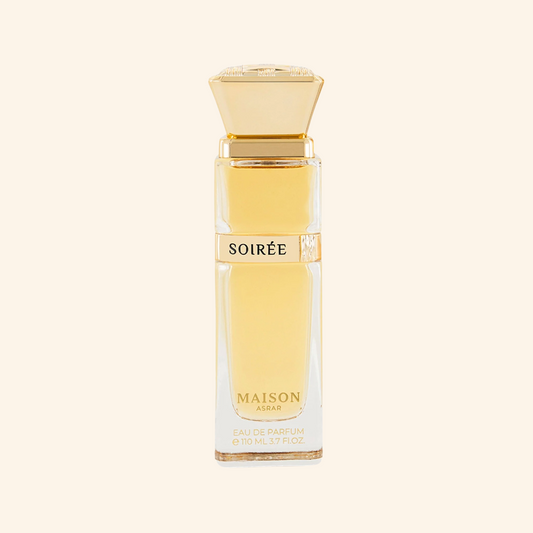 Perfume bottle labeled 'Soirée' by Maison Asrar on a white background. Discover Maison Asrar Soiree UK. A decadent unisex EDP with praline, plum, caramel & an ambergris vibe. A stunning Eilish alternative. Shop now at Nurabliss!
