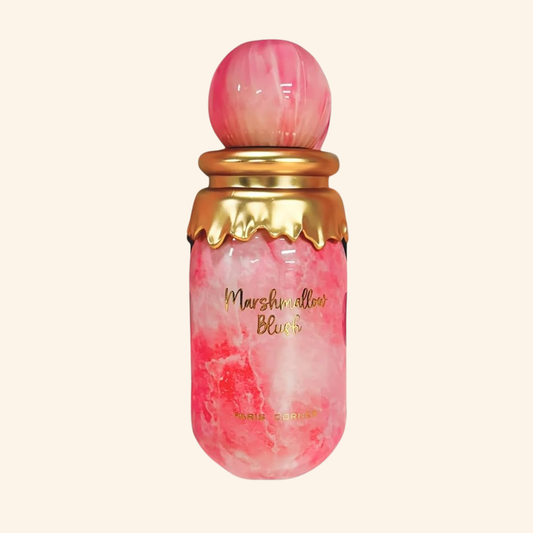 Pink and gold bottle of Marshmallow Blush on a light pink background. Discover Paris Corner Marshmallow Blush UK. A sweet women's EDP with strawberry, raspberry, orange blossom & marshmallow. A stunning Oriana alternative. Shop now!