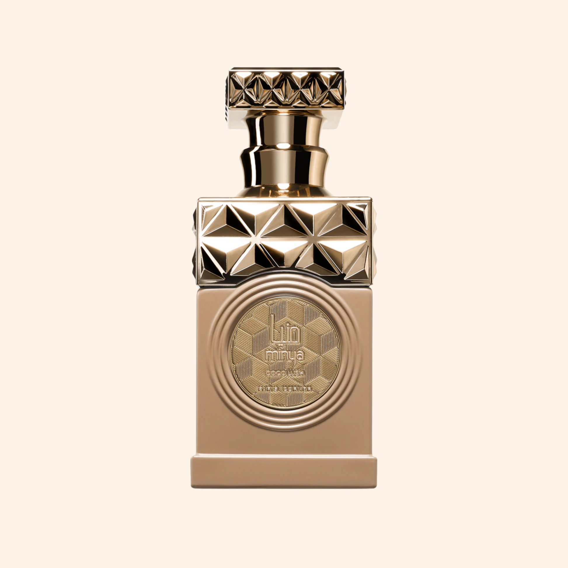Gold perfume bottle with geometric design on a beige background. Discover Paris Corner Minya Coco Lush UK. A fun, creamy gourmand EDP with coconut milk, raspberry & macarons. An  Thank U, Next alternative. Shop now!
