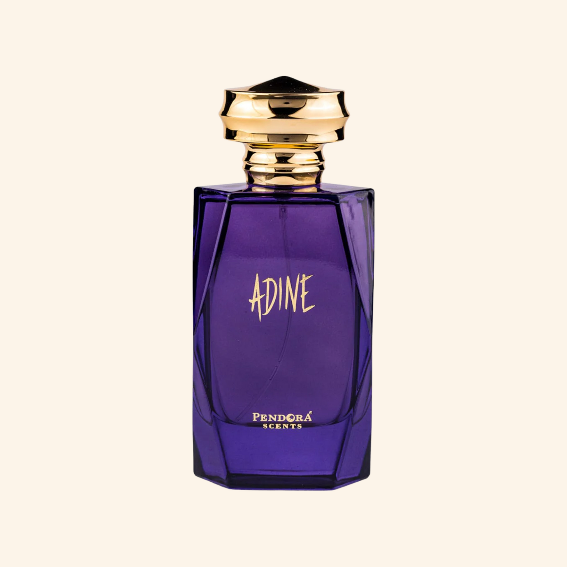 Purple perfume bottle with gold cap on a white background. Discover Pendora Scents by paris corner Adine . An iconic women's EDP with jasmine, cashmere wood & white amber. A stunning Alien alternative. Shop now nurabliss!